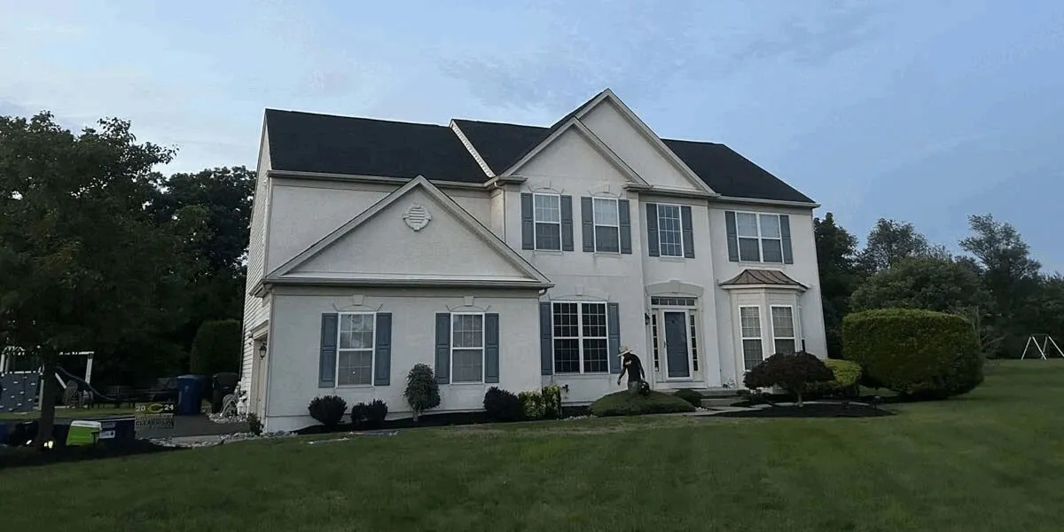 After: the same home with its finished new roof